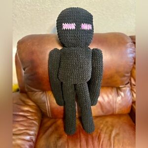 Black Plush Toy with Pink Accents